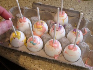 Lollipop stick in filled egg shells