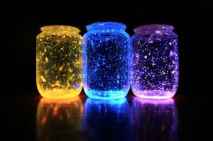 Three colored glowing jars